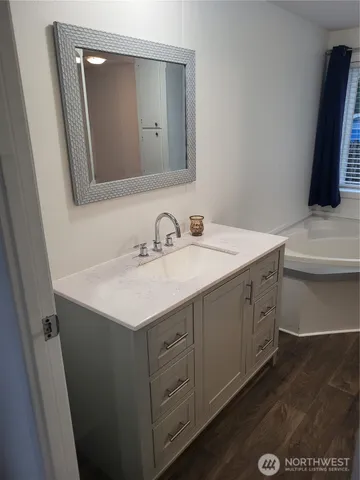 a bathroom with a sink and a mirror