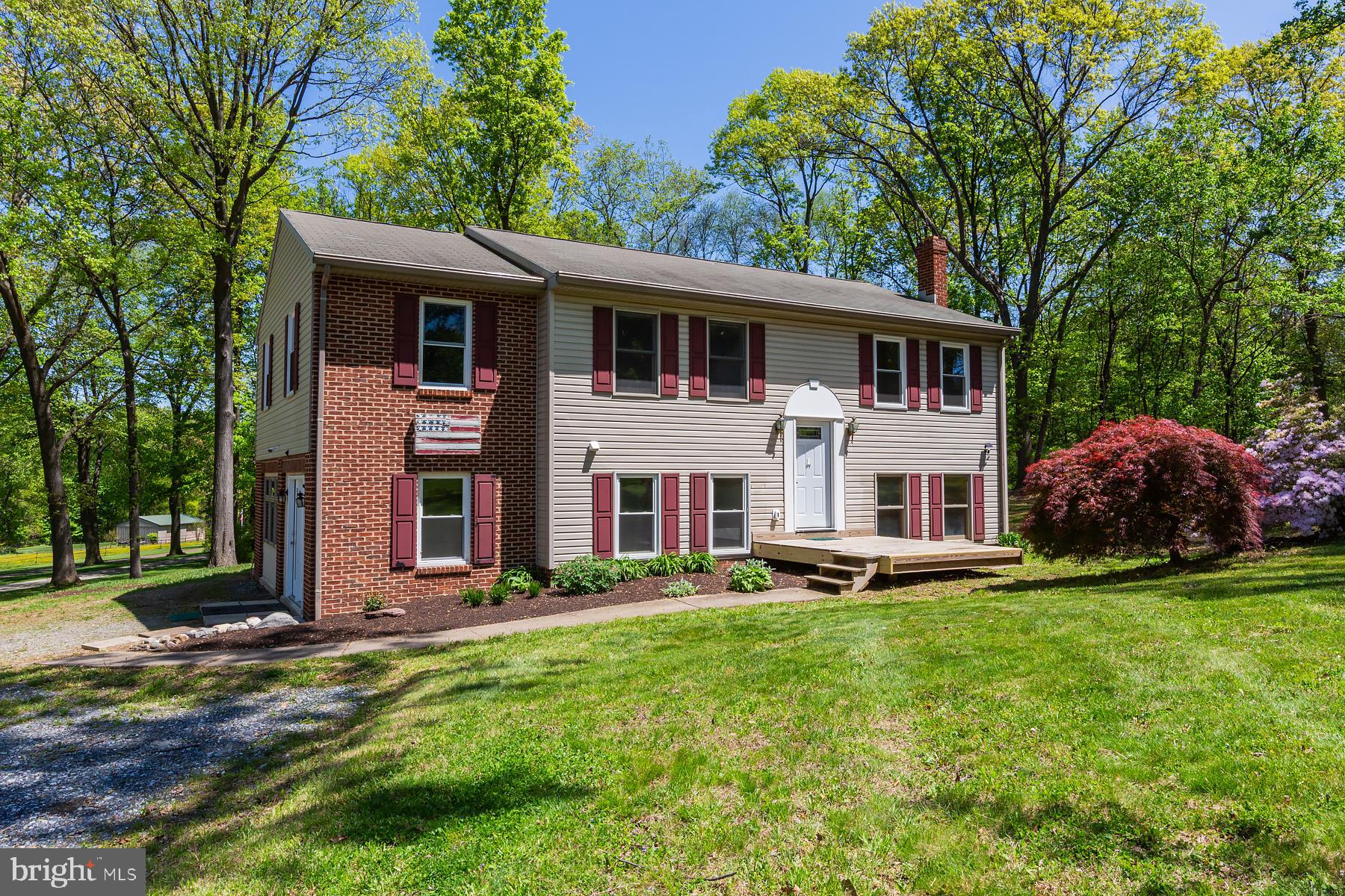451 Red Hill Road Pequea, PA 17565 - Photo 1 of 52 a front view of a house with a yard