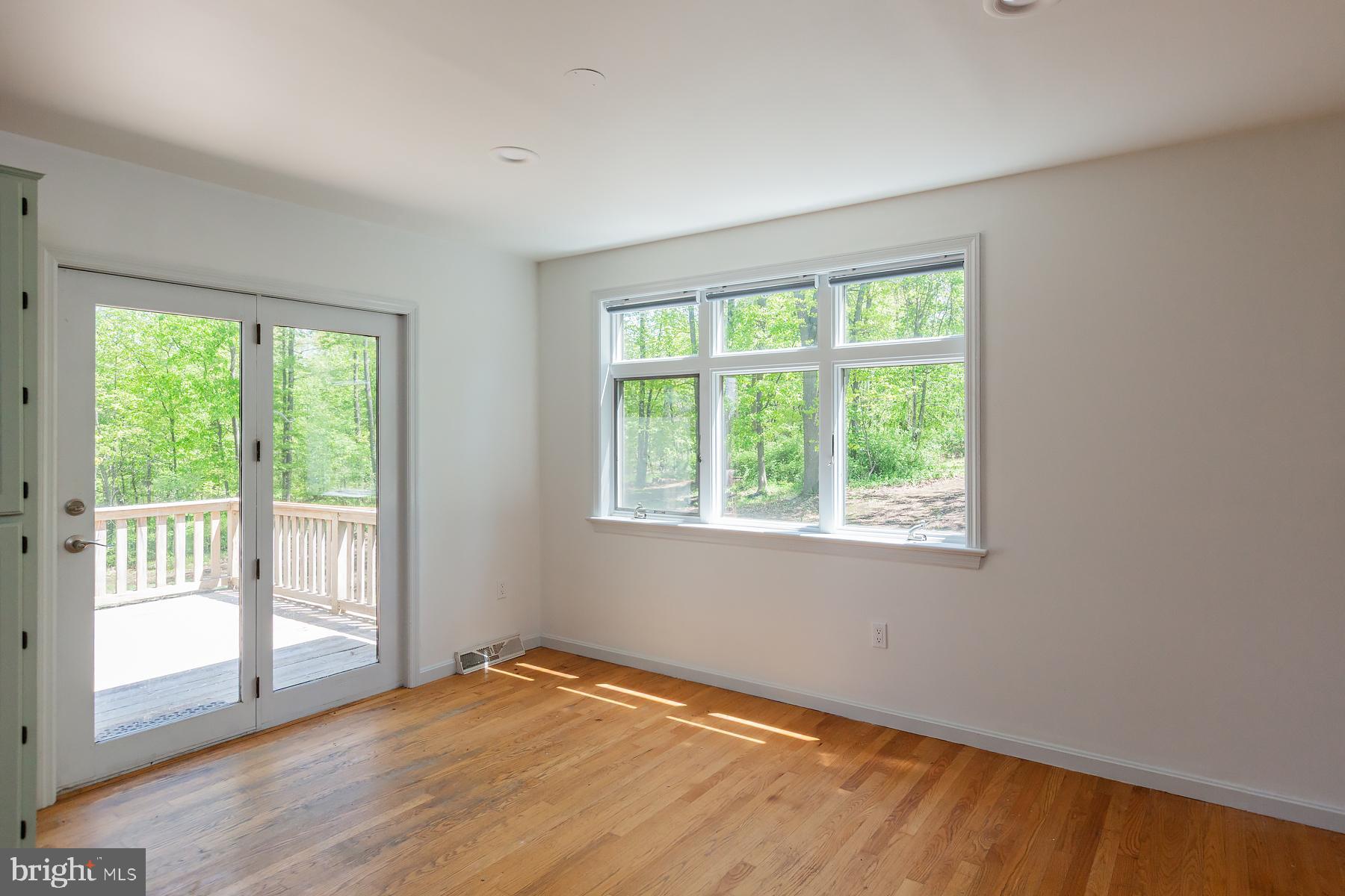 451 Red Hill Road Pequea, PA 17565 - Photo 12 of 52 a view of an empty room with wooden floor and a window
