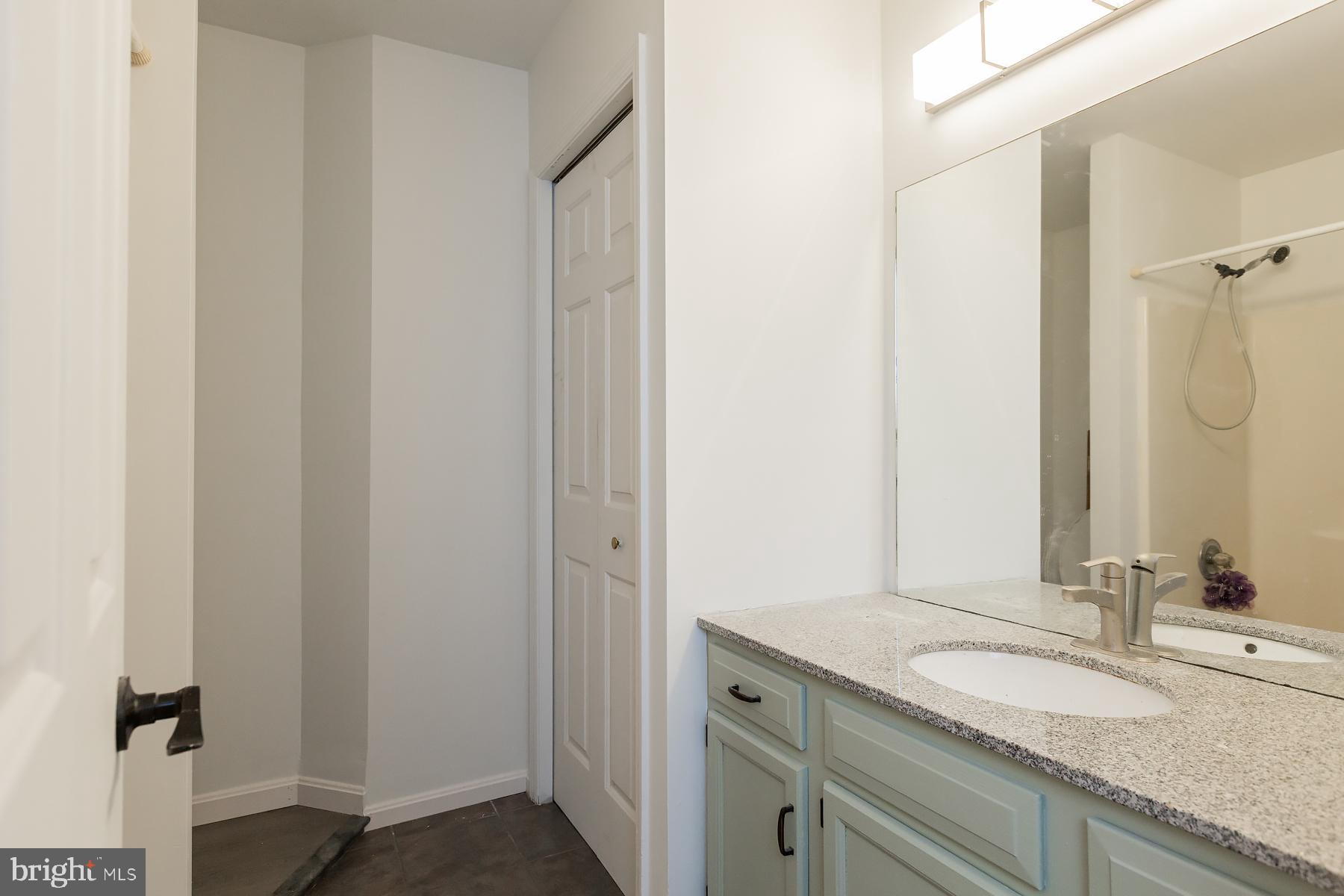 451 Red Hill Road Pequea, PA 17565 - Photo 13 of 52 a bathroom with a granite countertop sink and a mirror
