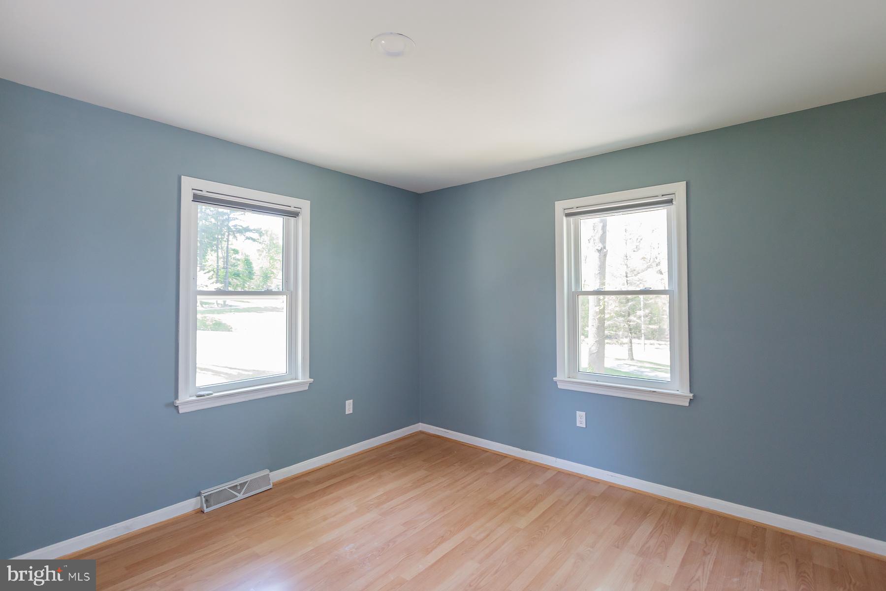451 Red Hill Road Pequea, PA 17565 - Photo 17 of 52 a view of an empty room with wooden floor and a window