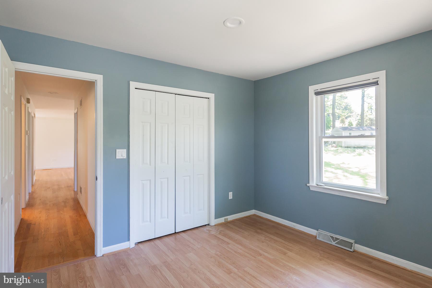 451 Red Hill Road Pequea, PA 17565 - Photo 18 of 52 a view of an empty room with wooden floor and a window