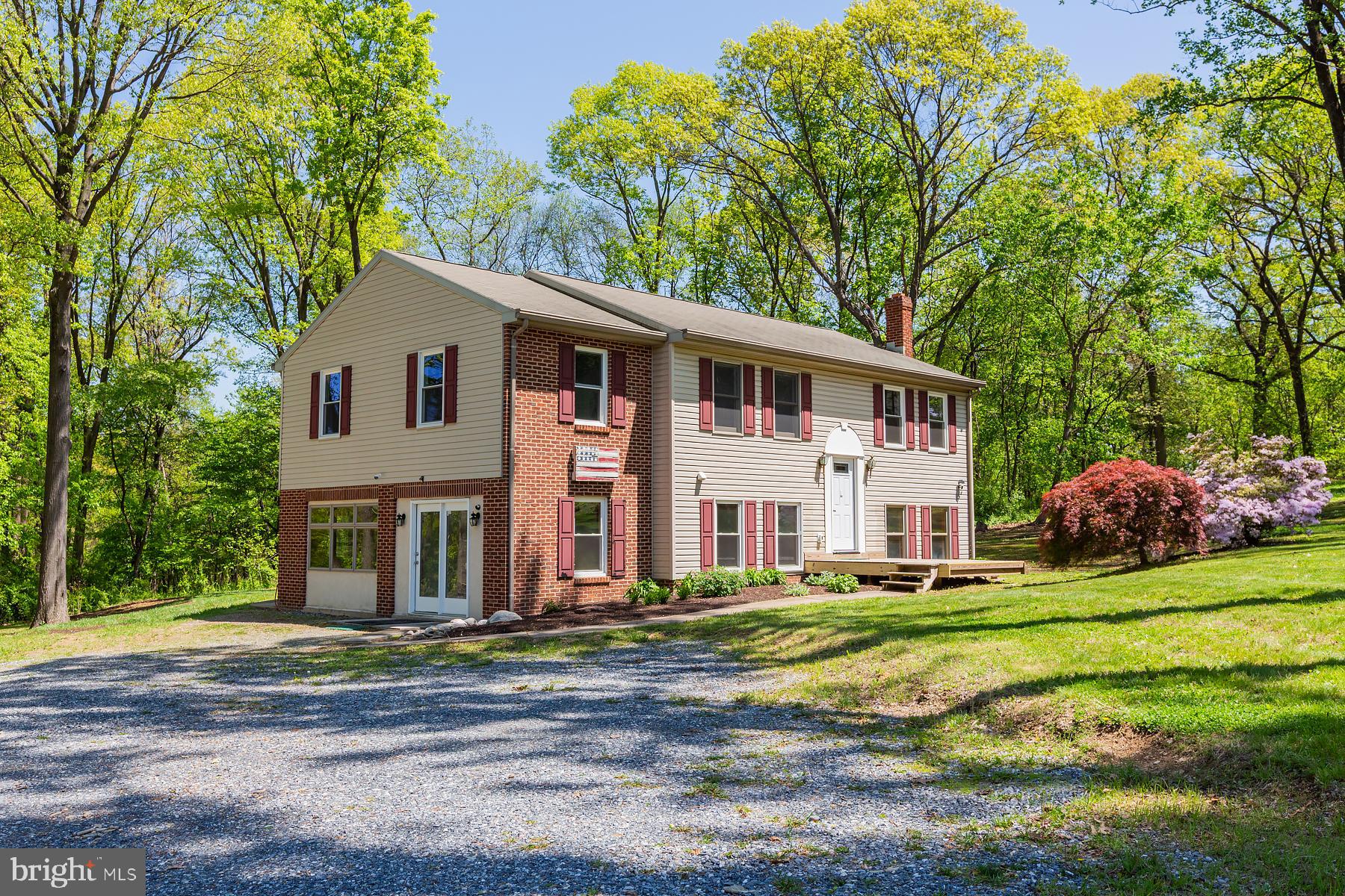 451 Red Hill Road Pequea, PA 17565 - Photo 2 of 52 a front view of a house with a yard