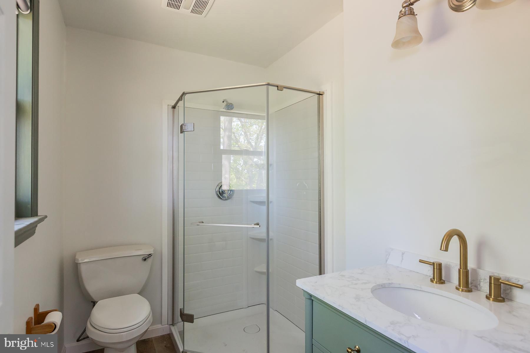 451 Red Hill Road Pequea, PA 17565 - Photo 21 of 52 a bathroom with a toilet sink vanity and shower