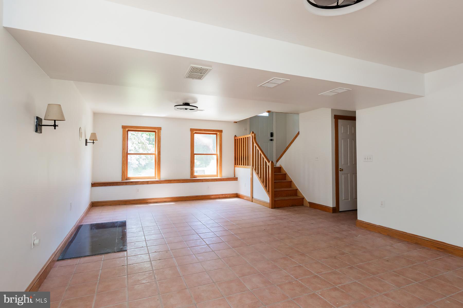 451 Red Hill Road Pequea, PA 17565 - Photo 24 of 52 a view of an empty room with wooden floor and a window