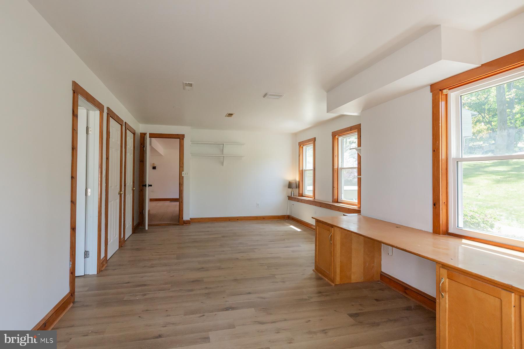 451 Red Hill Road Pequea, PA 17565 - Photo 33 of 52 a view of an empty room with wooden floor and a window