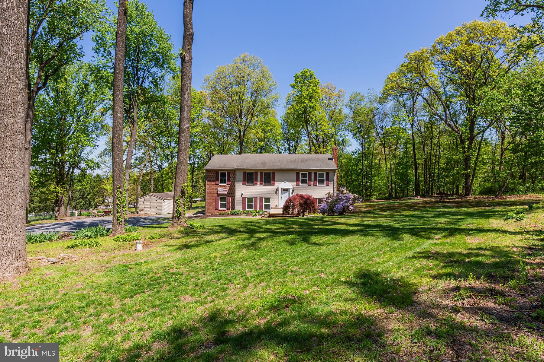 451 Red Hill Road Pequea, PA 17565 - Photo 52 of 52 a view of a house with a big yard and large trees
