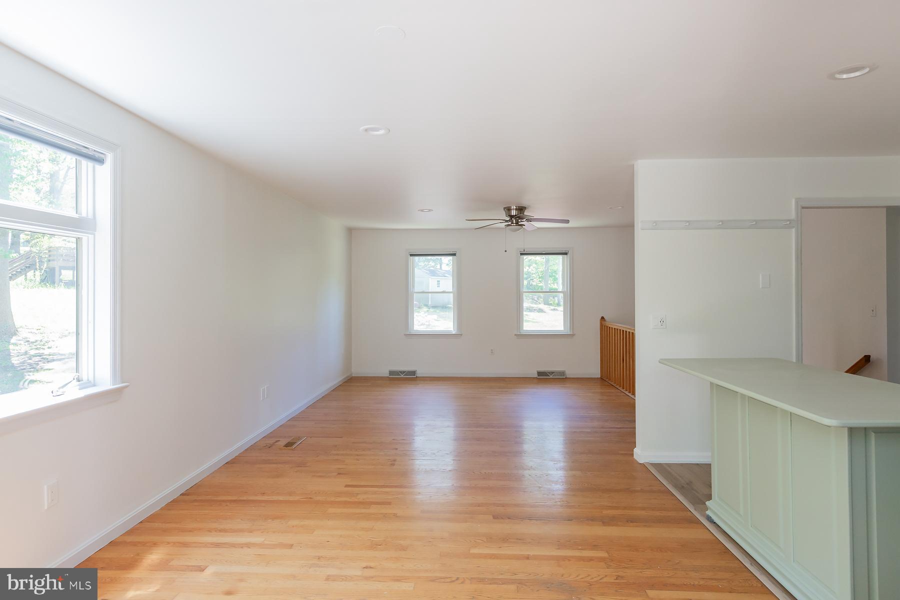 451 Red Hill Road Pequea, PA 17565 - Photo 9 of 52 a view of an empty room with wooden floor and a window