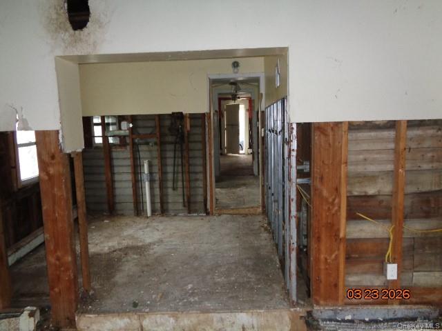 19 East 10th Road Queens, NY 11693 - Photo 3 of 7 a view of a hallway with wooden shelves