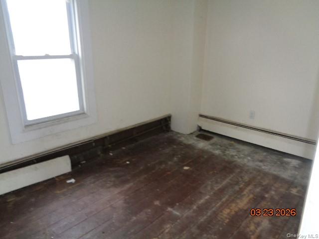 19 East 10th Road Queens, NY 11693 - Photo 4 of 7 a view of an empty room and window