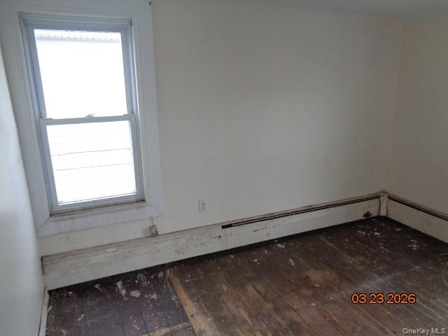 19 East 10th Road Queens, NY 11693 - Photo 6 of 7 a view of a small space with wooden floor and a window