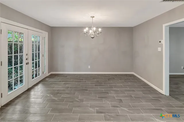 a view of a kitchen with a sink and a large window