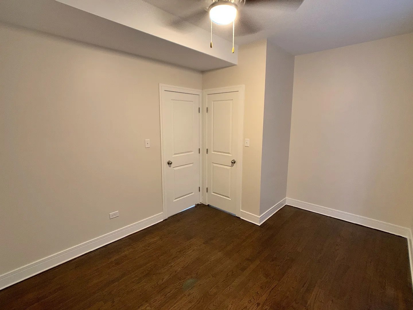 3306 West Cullom Avenue, Unit 1 Chicago, IL 60618 - Photo 8 of 16 an empty room with wooden floor