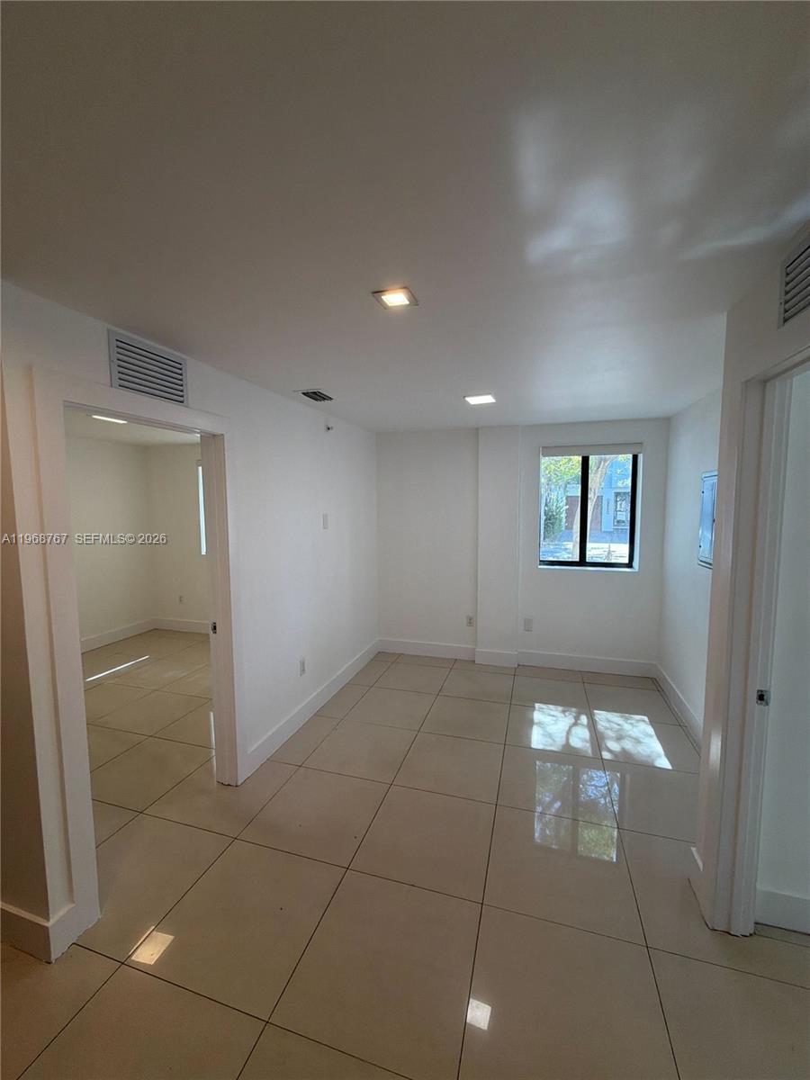 829 Southwest 18th Avenue, Unit 109 Miami, FL 33135 - Photo 10 of 10 a view of an empty room and window