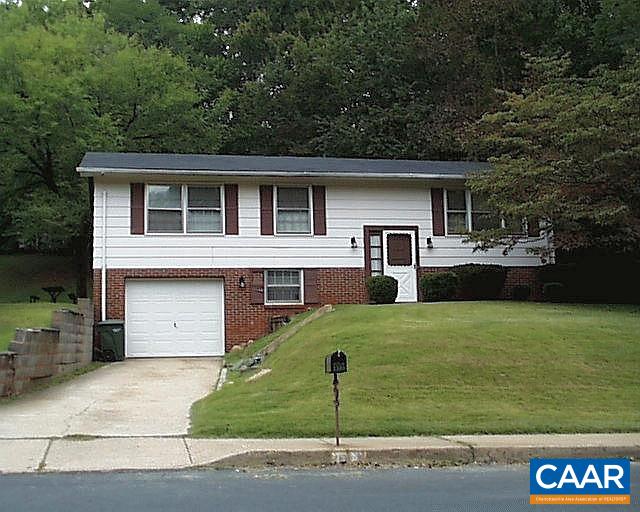 1509 Ricky Road Charlottesville, VA 22901 - Photo 1 of 10 a front view of a house with a yard and garage