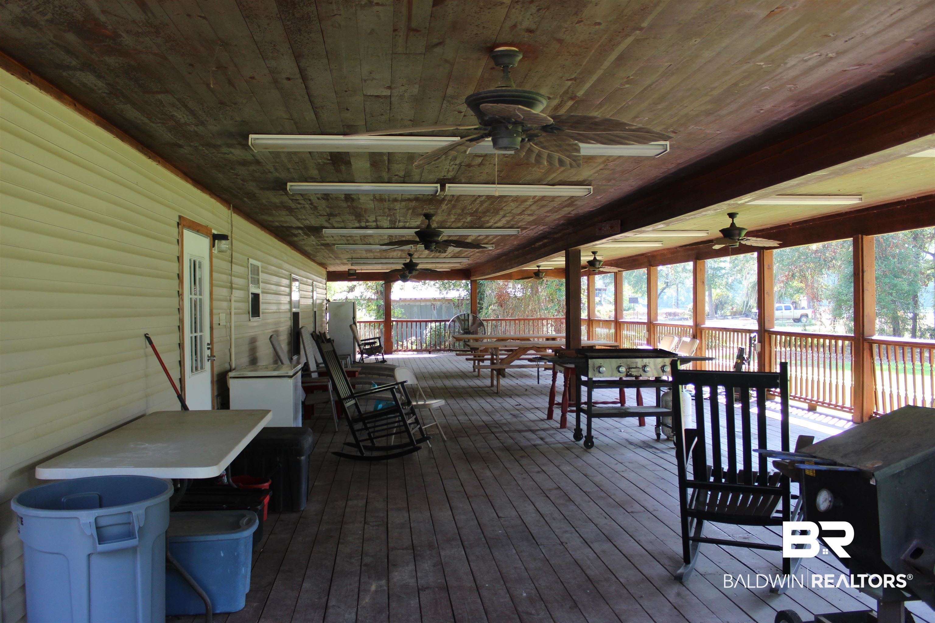 7258 Henderson Road Lowndesboro, AL 36752 - Photo 8 of 22 Deck featuring a ceiling fan and outdoor dining space