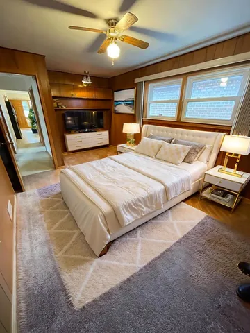 a kitchen with a sink a stove top oven and cabinetry