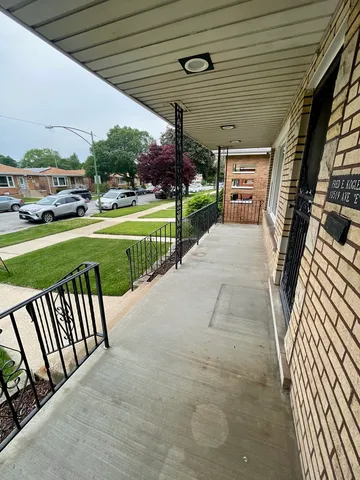 a view of a patio with a yard