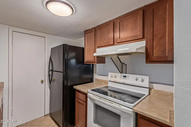 a kitchen with a stove microwave and refrigerator