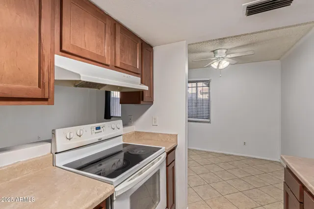 a kitchen with a stove and a microwave