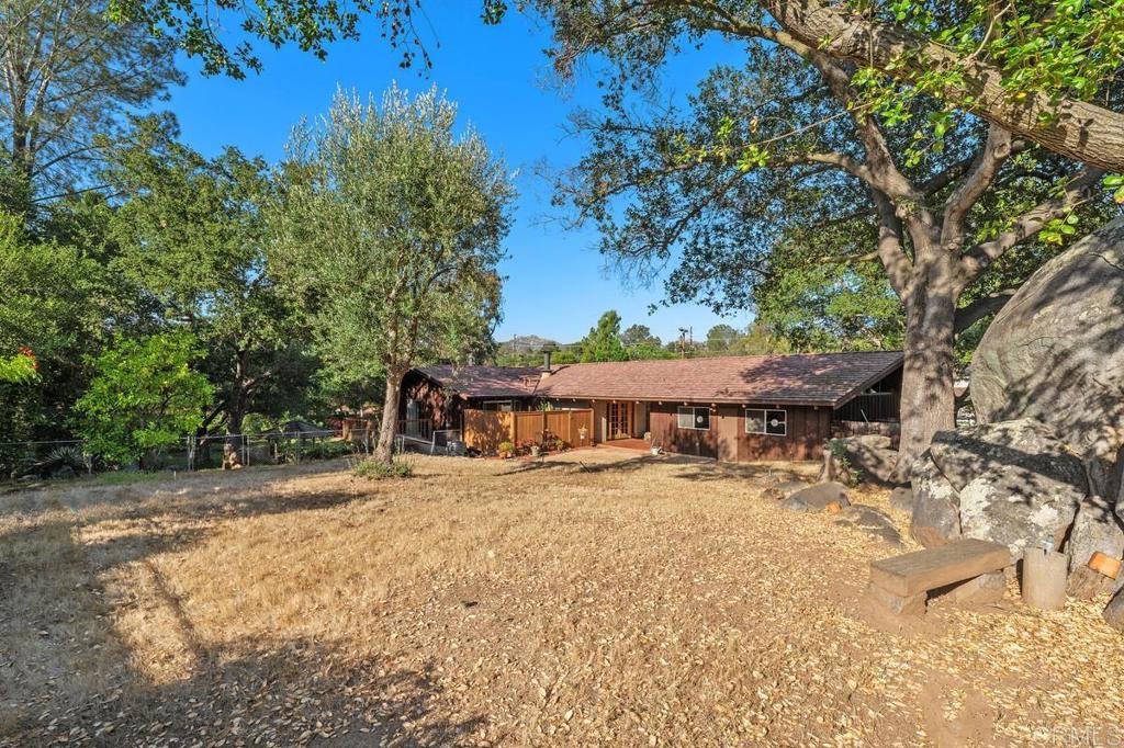 16522 Orchard Bend Road Poway, CA 92064 - Photo 21 of 26 a view of a house with a yard covered in snow