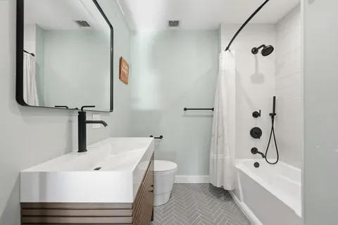 a view of a hallway with washer and dryer