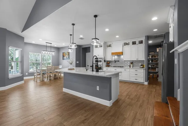 a kitchen with cabinets and window
