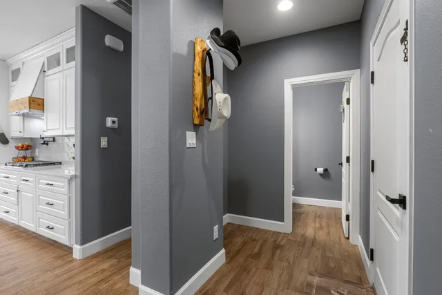 a view of a dining room with furniture wooden floor and chandelier
