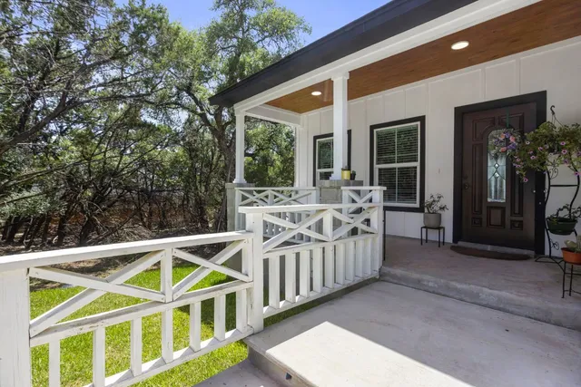 a view of a house with porch and furniture