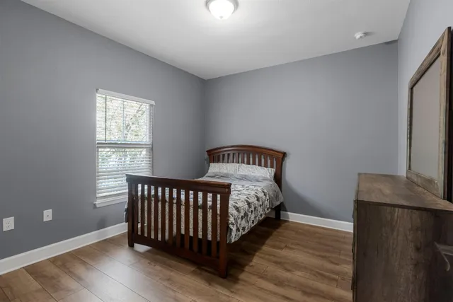 a bathroom with a sink vanity and a mirror