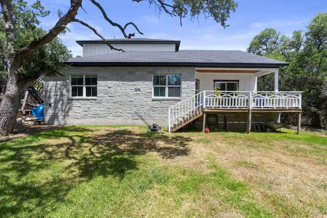 a view of balcony with wooden floor and outdoor seating