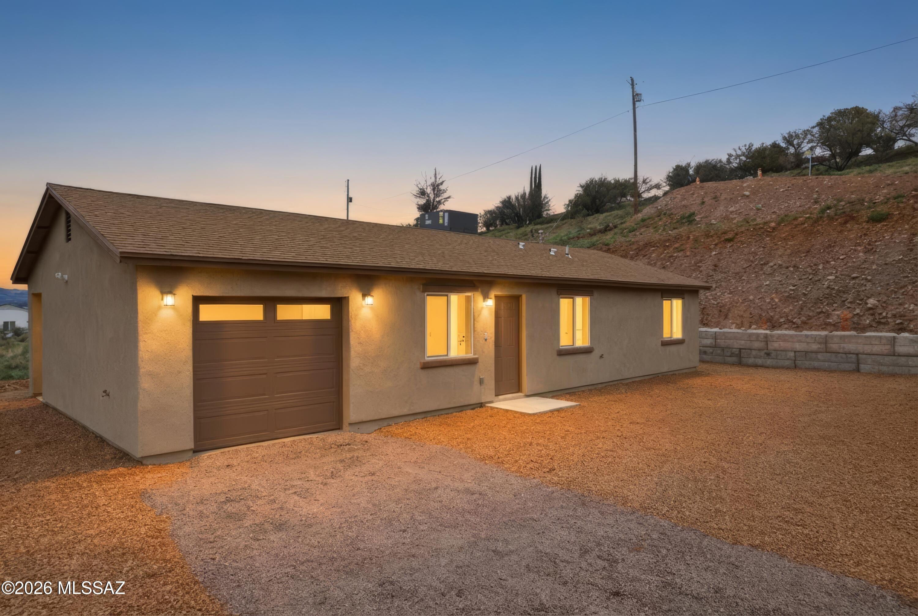 423 Rio Rico Drive Rio Rico, AZ 85648 - Photo 2 of 47 46-DJI_0097_twilight_3245c727-9b96-43c0-