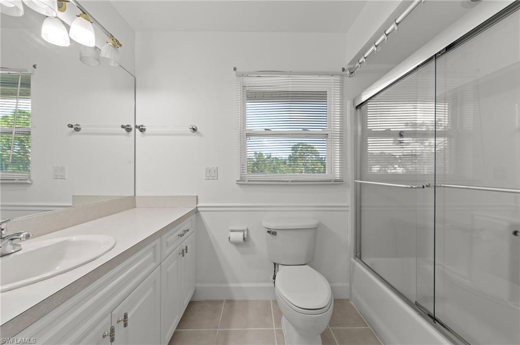 13541 Stringfellow Road Bokeelia, FL 33922 - Photo 19 of 49 a bathroom with a sink toilet vanity and shower