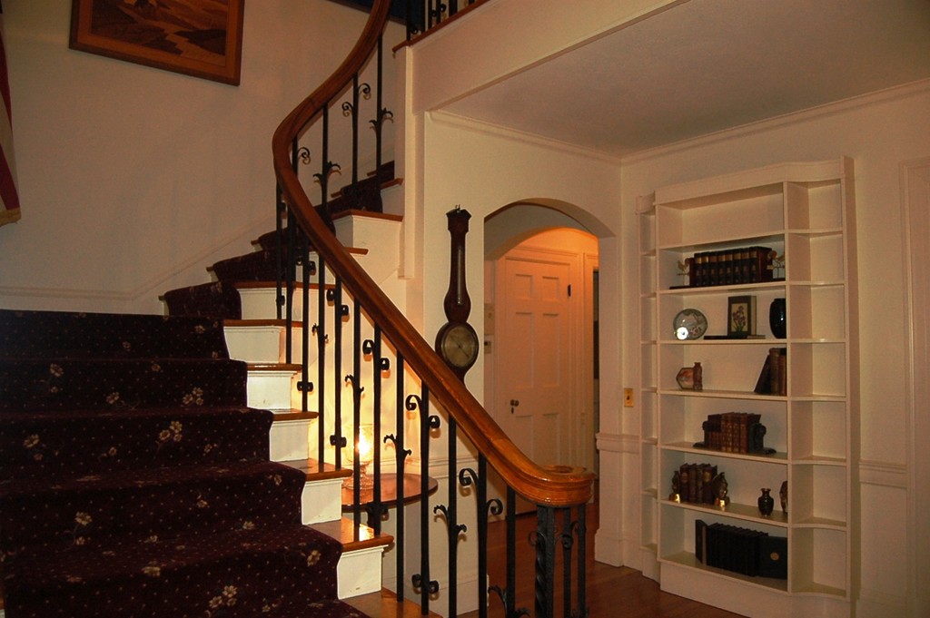 346 Gaskill Street Woonsocket, RI 02895 - Photo 13 of 25 a view of staircase with lots of frames on wall and a window