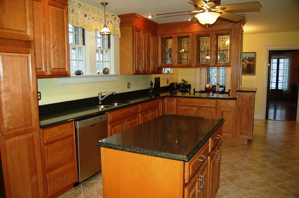 346 Gaskill Street Woonsocket, RI 02895 - Photo 3 of 25 a kitchen with stainless steel appliances granite countertop a sink a stove and a refrigerator