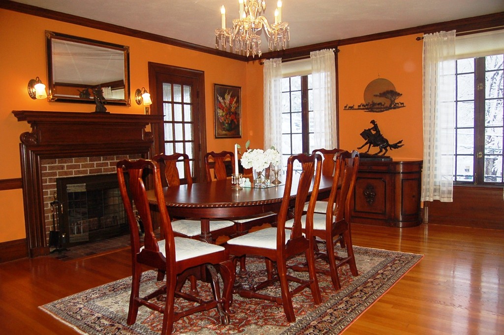 346 Gaskill Street Woonsocket, RI 02895 - Photo 6 of 25 a dining room with furniture a chandelier and wooden floor