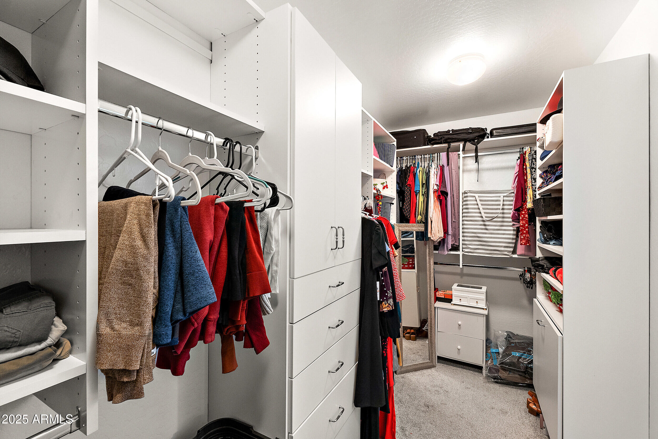 3643 West Medinah Court Anthem, AZ 85086 - Photo 12 of 58 a view of walk in closet with clothes and shoes