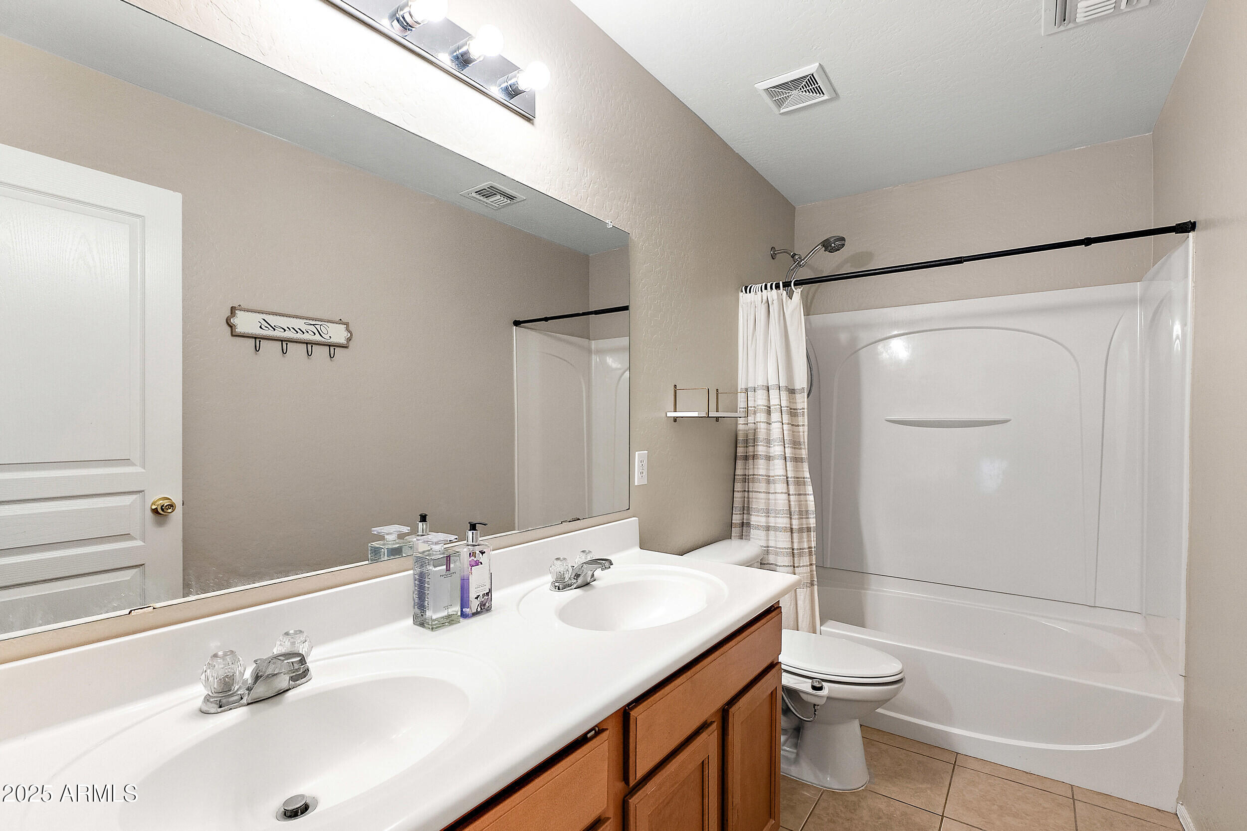 3643 West Medinah Court Anthem, AZ 85086 - Photo 14 of 58 a bathroom with a sink toilet and shower