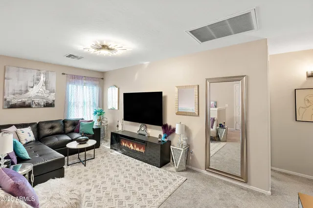 a living room with furniture and a window