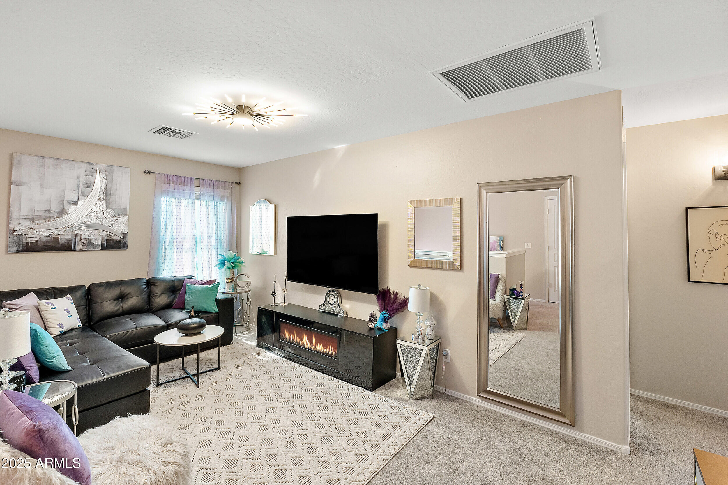 3643 West Medinah Court Anthem, AZ 85086 - Photo 15 of 58 a living room with furniture and a flat screen tv