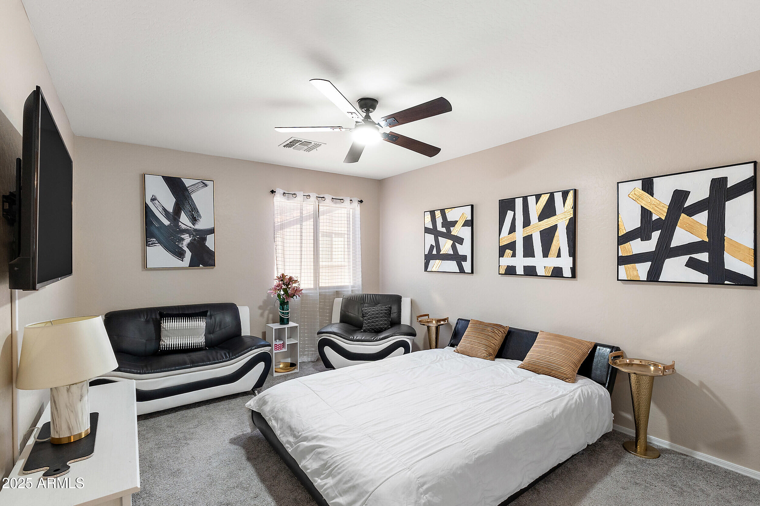 3643 West Medinah Court Anthem, AZ 85086 - Photo 17 of 58 a bedroom with a bed and a couch