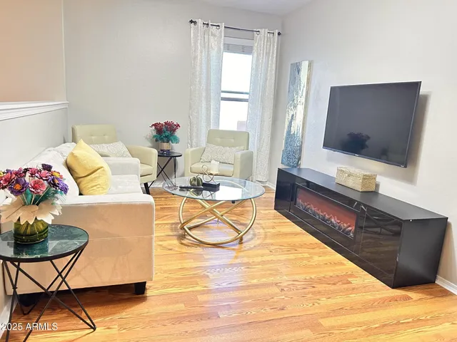 a living room with furniture and a window