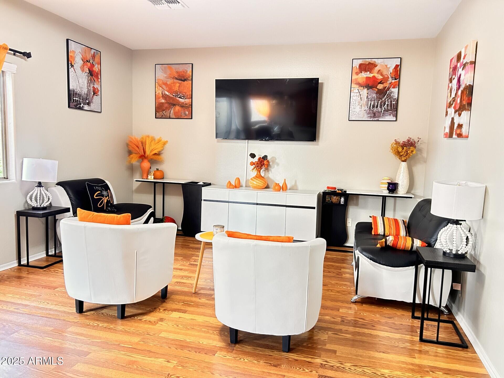 3643 West Medinah Court Anthem, AZ 85086 - Photo 28 of 58 a living room with furniture and a flat screen tv
