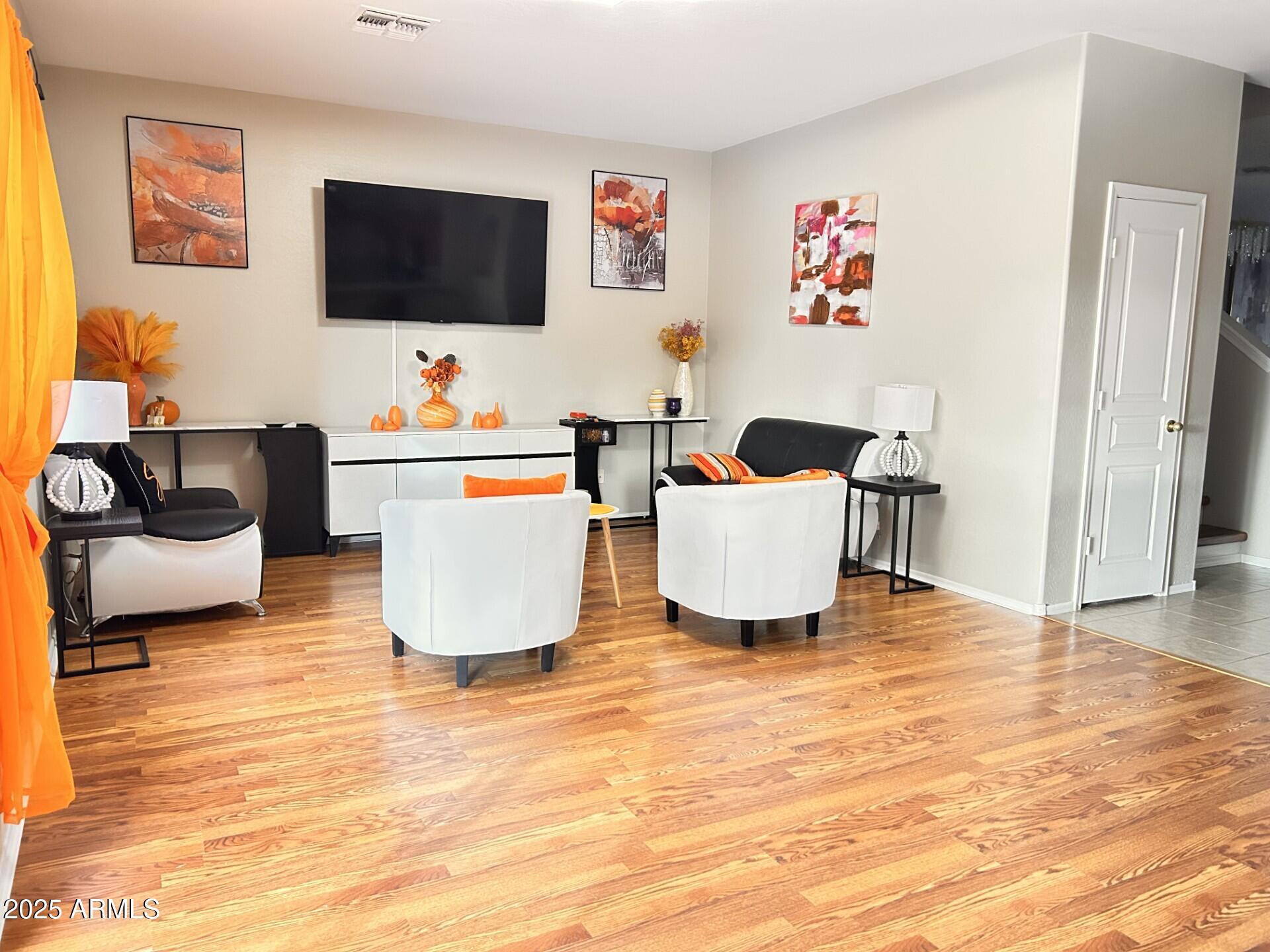 3643 West Medinah Court Anthem, AZ 85086 - Photo 29 of 58 a living room with furniture and a flat screen tv