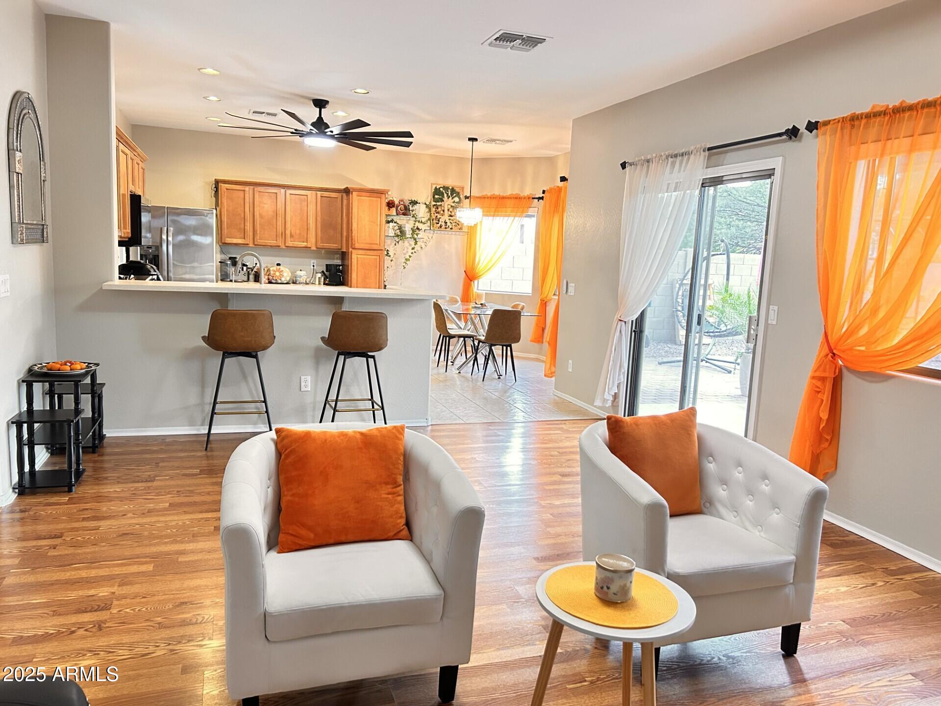 3643 West Medinah Court Anthem, AZ 85086 - Photo 30 of 58 a living room with furniture and a large window