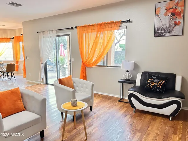 a view of living room with furniture and window