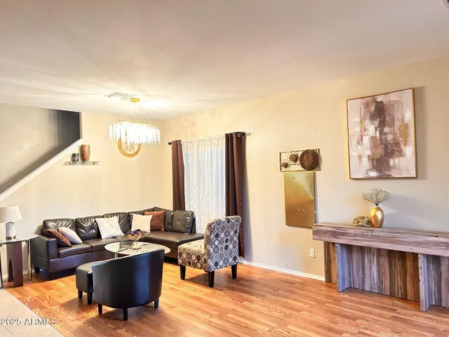 a view of entryway with wooden floor and stairs