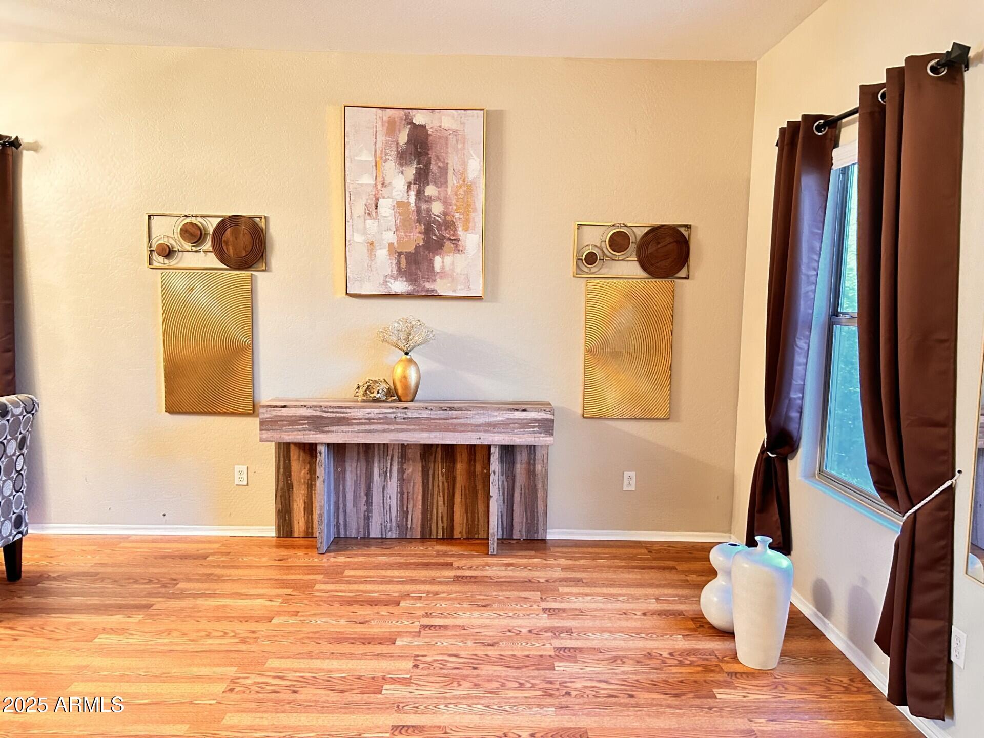 3643 West Medinah Court Anthem, AZ 85086 - Photo 34 of 58 a view of a living room with furniture and a window