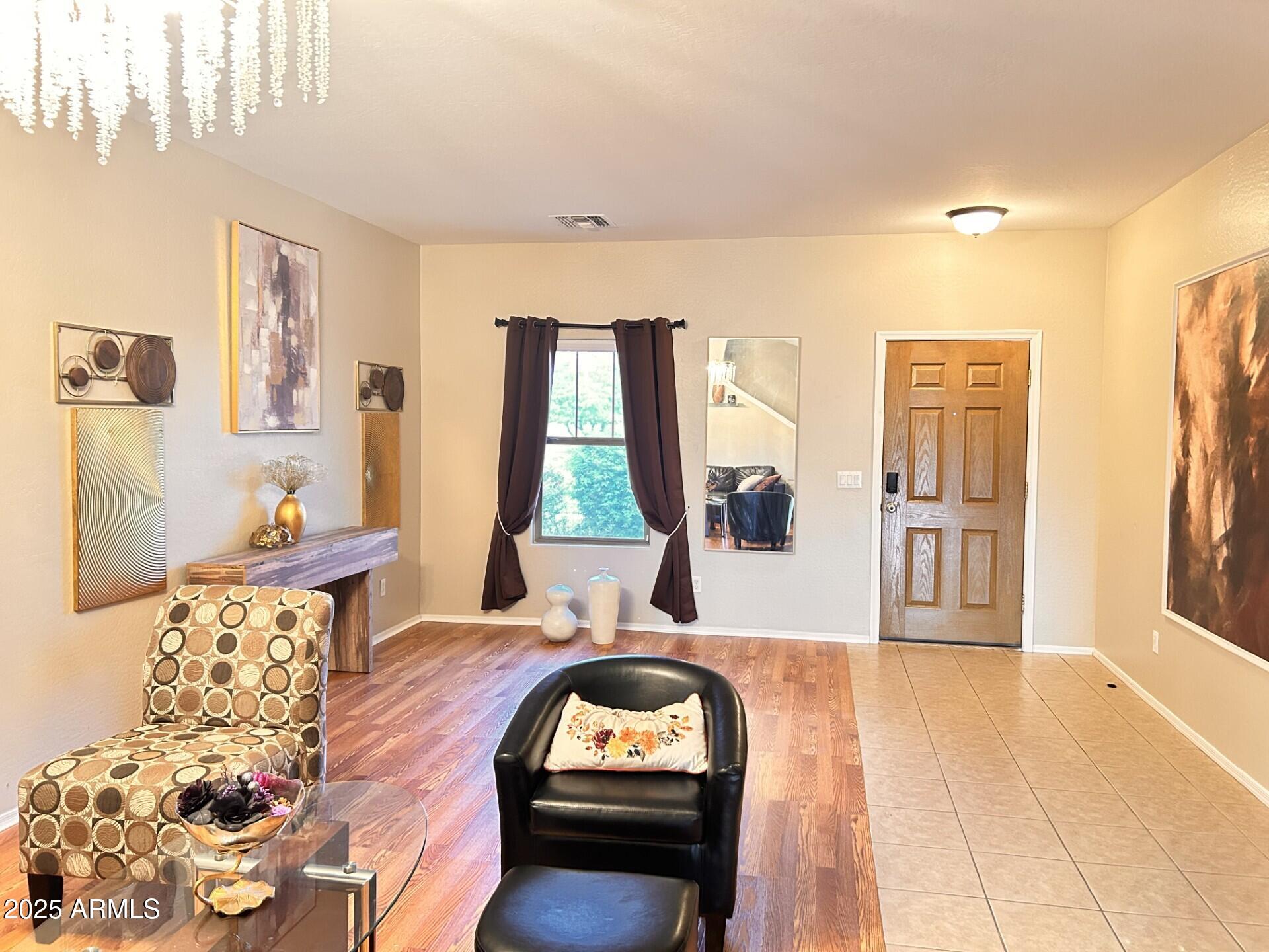 3643 West Medinah Court Anthem, AZ 85086 - Photo 39 of 58 a living room with furniture and a large window
