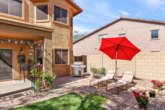 a view of a swimming pool with a patio